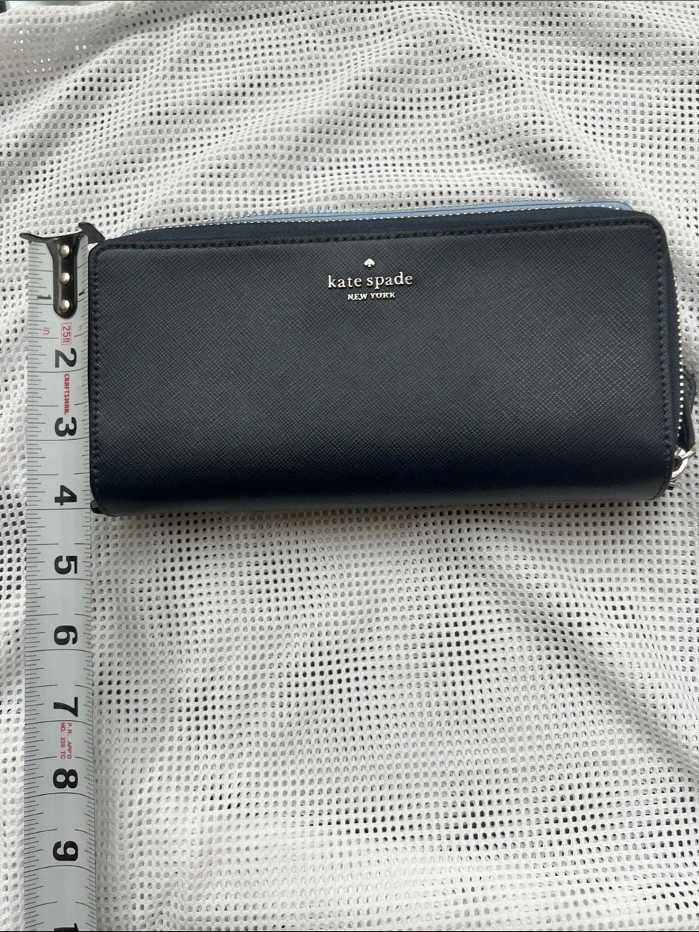 kate spade navy zip-around leather wallet with blue trim